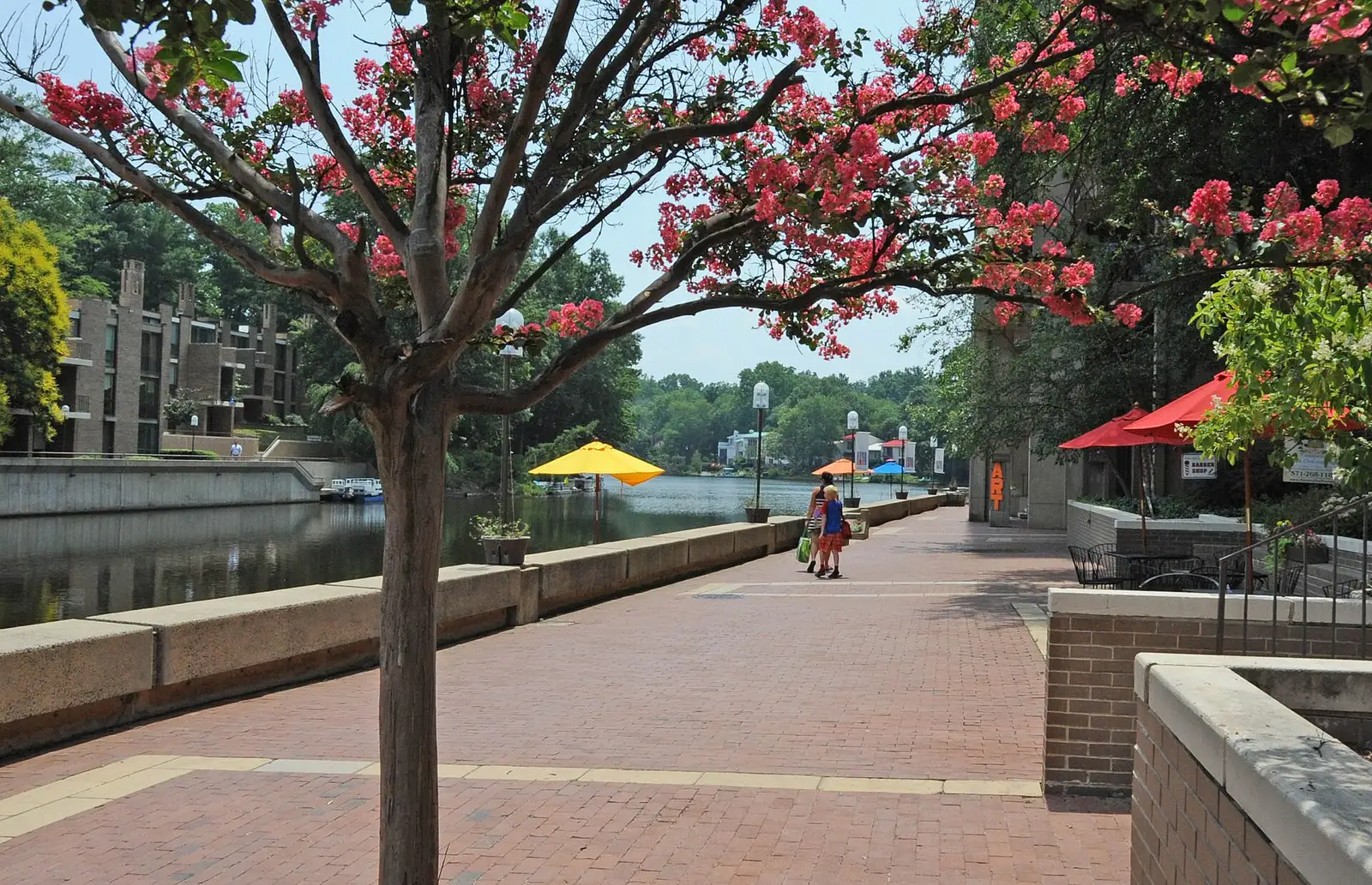 The brick promenade and boat docks along the Lake Anne inlet at Lake Anne Village Center in Reston.