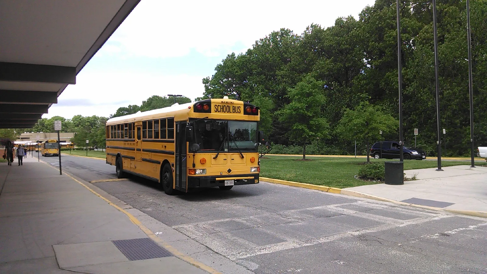 A Fairfax County Public Schools bus pulls away from the bus loop at South Lakes High School in Reston