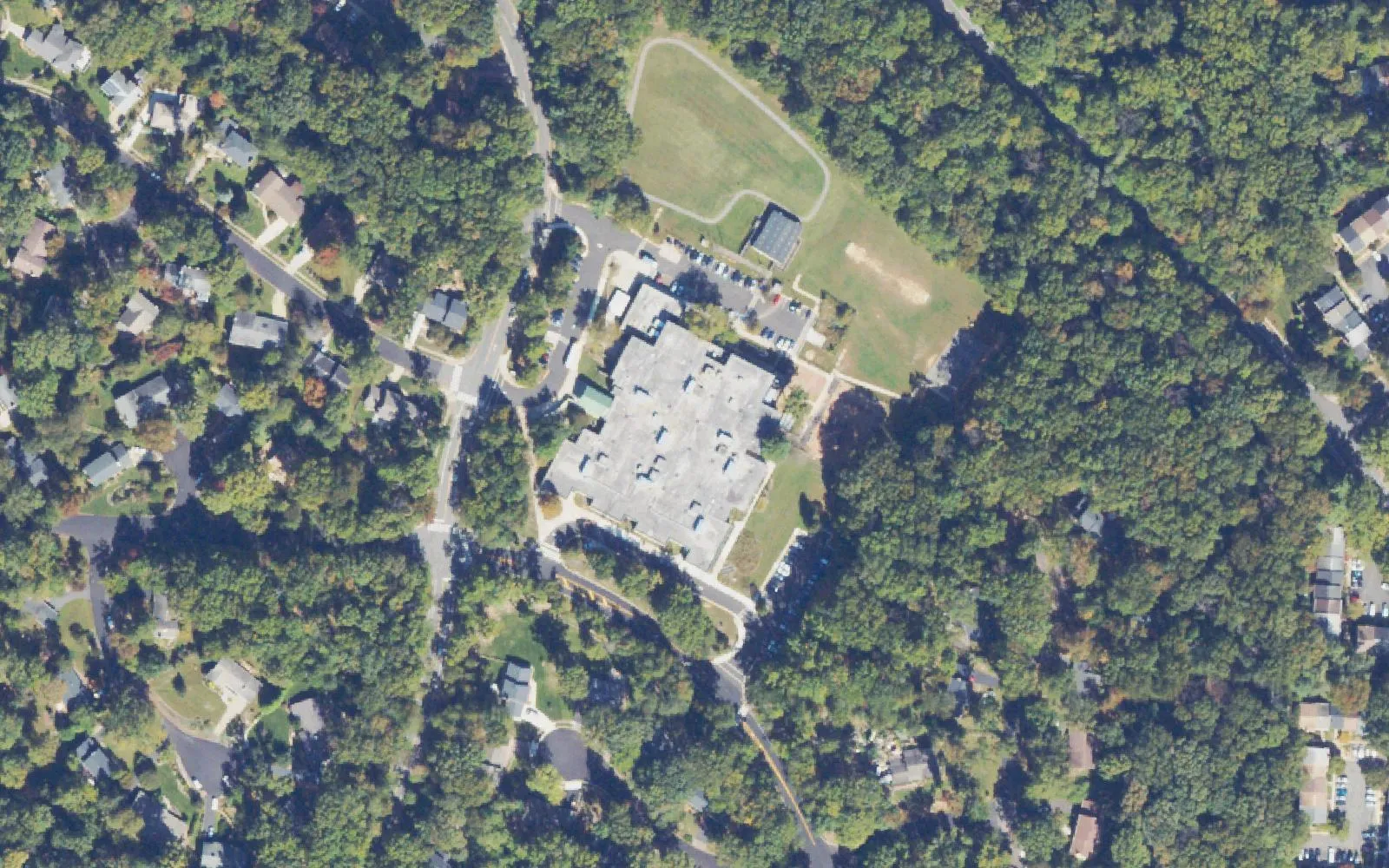 Hunters Woods Elementary School on Colts Neck Road in south Reston, with its playing field and the woods around it, seen from the air