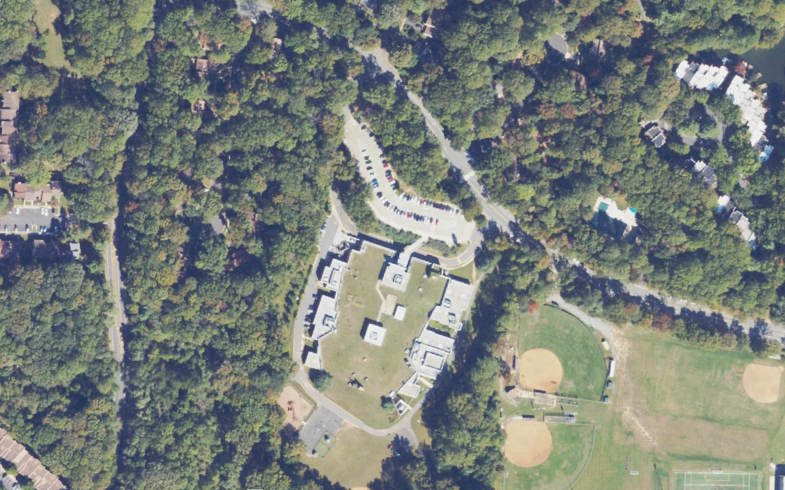 Terraset Elementary School on Ridge Heights Road in Reston, the earth-covered school with its grass roof, beside the Hughes Middle and South Lakes High fields, seen from the air